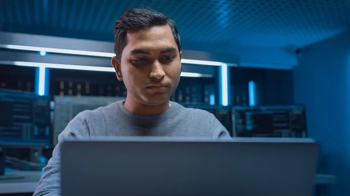 photo of man front of computer